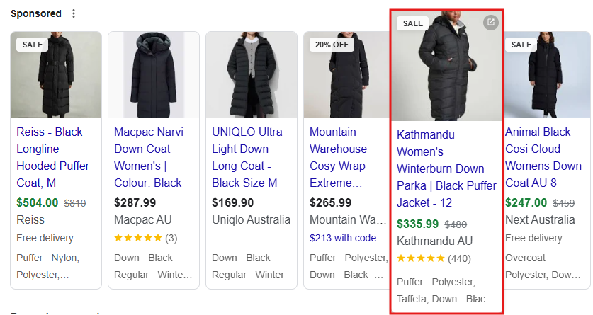 Sponsored Google Shopping results page showing women’s black puffer coats, highlighting Kathmandu Women’s Winterburn Down Parka with price and rating.